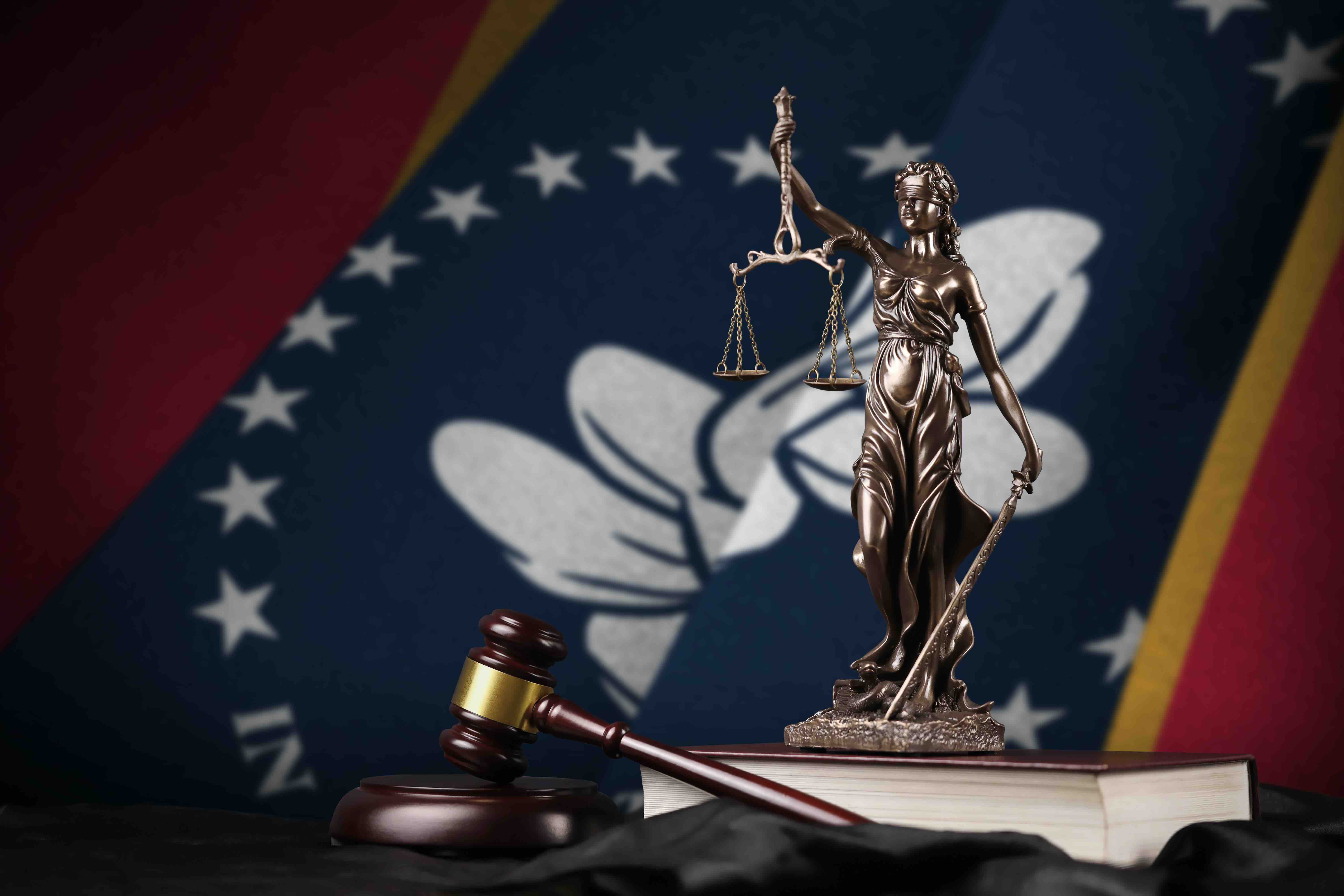 Mississippi flag with scales of justice and gavel