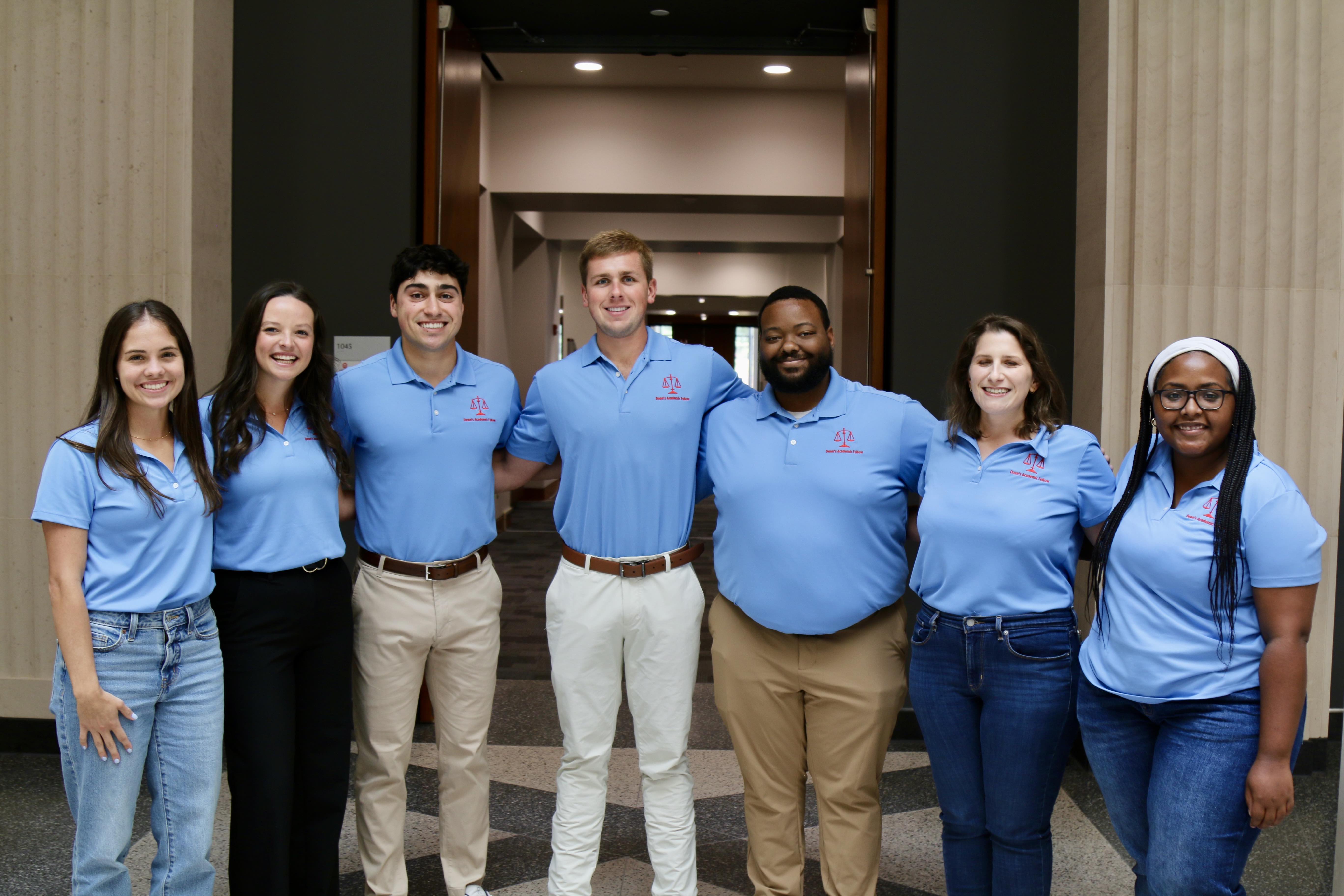 This year's academic fellows stand in front of the law library 