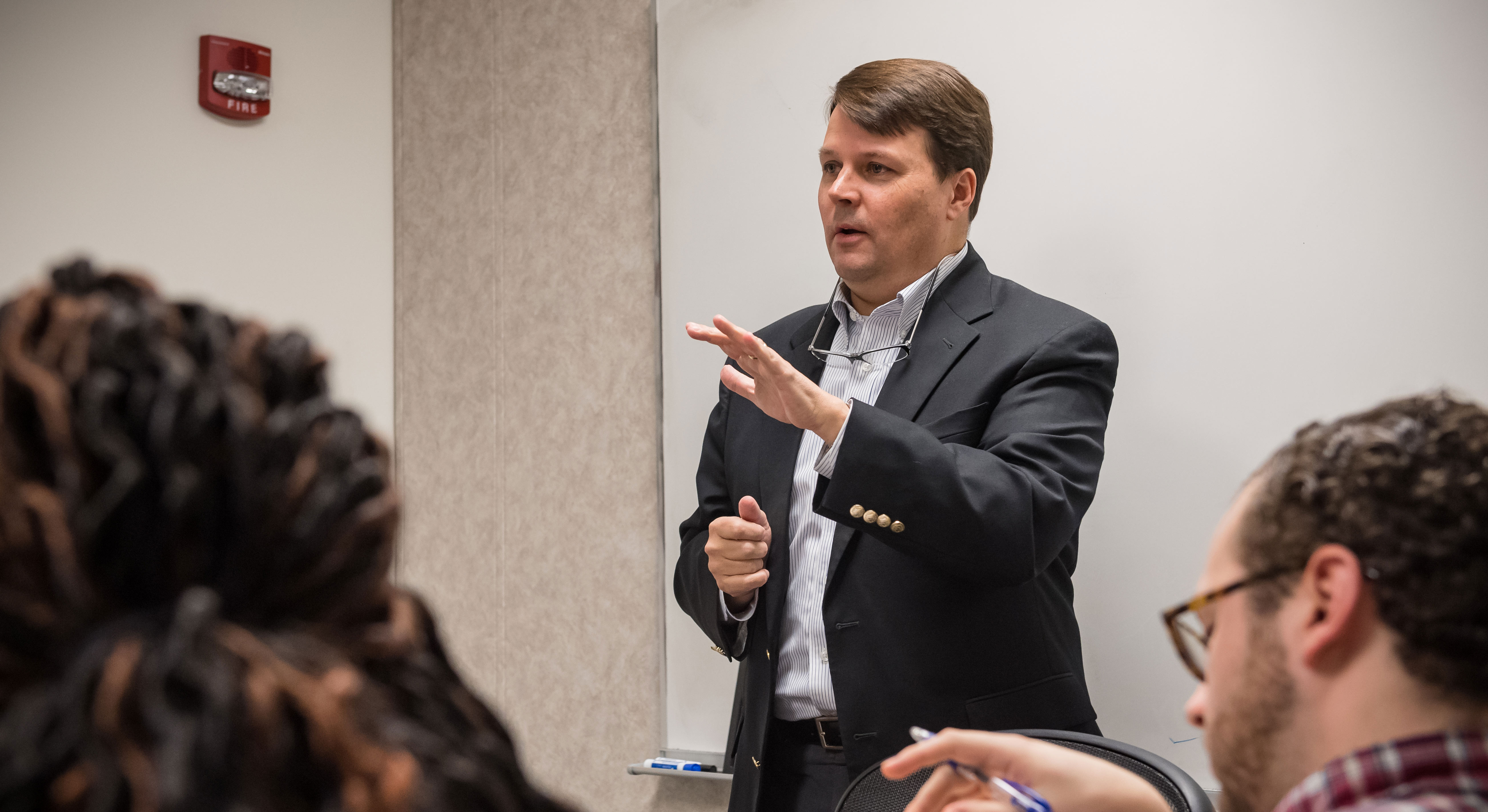 Photo of Prof Cliff Johnson, teaching a class