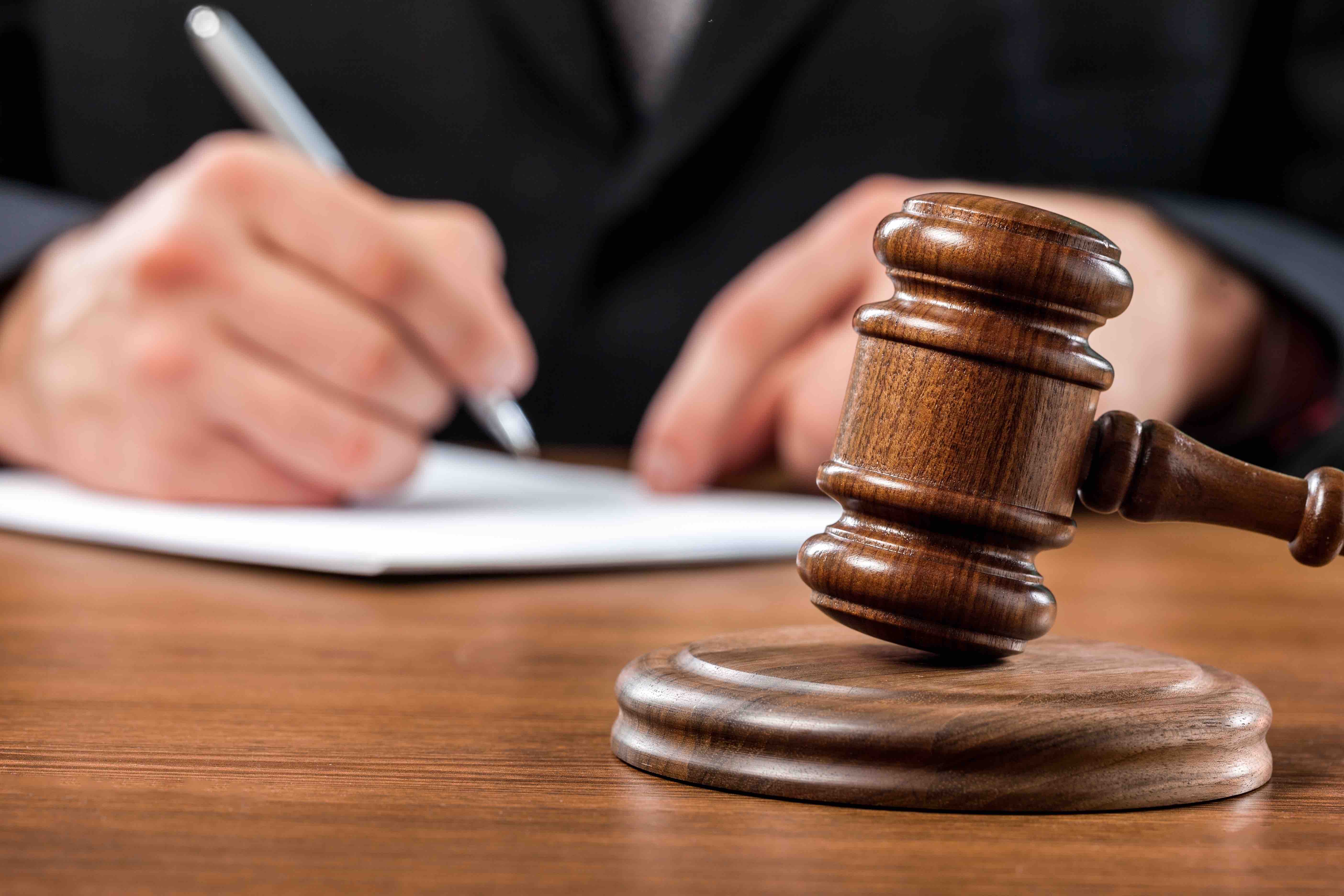 judge with gavel in foreground