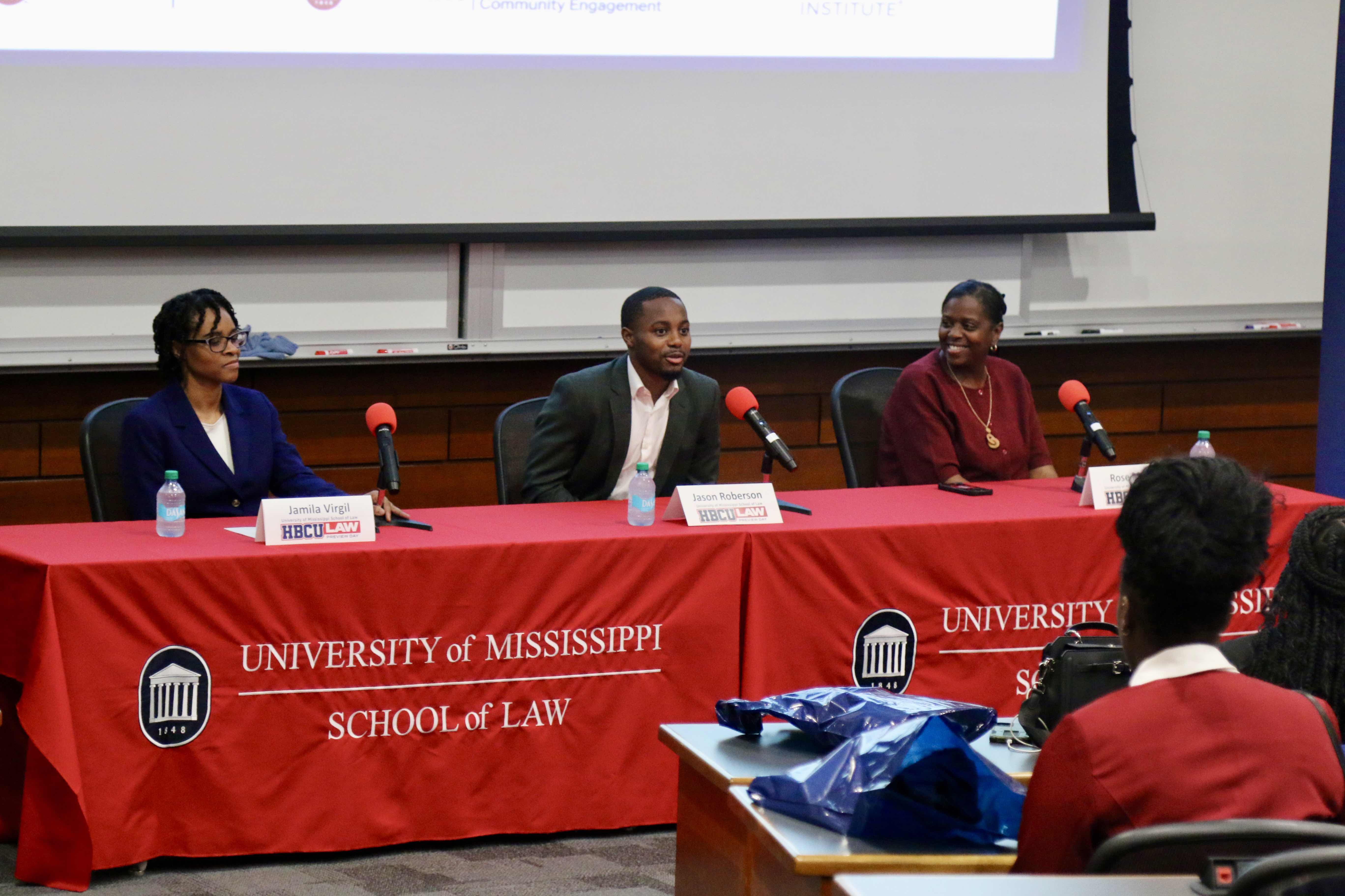 Faculty member Jamila Virgil, student Jason Roberson, and staff member Rose Maten speak with students during a panel