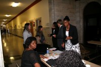 The clinic registration table: Yumekia Jones (seated), Nicole Jones (standing in front of Yumekia), Laci Moore, Briley Elliott, Macy McCarty, Tiffany Graves and Paul Pritchard standing).
