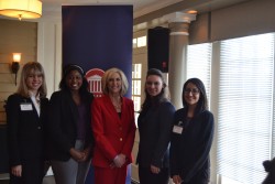 Student presenters Marie Wicks, Sampada Kapoor, Jessica Rice, and Izzy Robinson are pictured with State Treasurer Lynn Fitch.