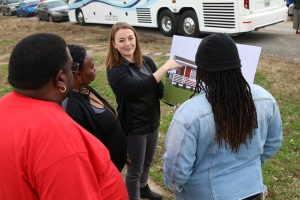 An architect shows residents of Eastmoor Circle renderings of their new homes. 